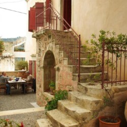 Entrance with stone stairs and spacious outdoor area of Sior Nikoletos, a traditional villa in Southern Crete